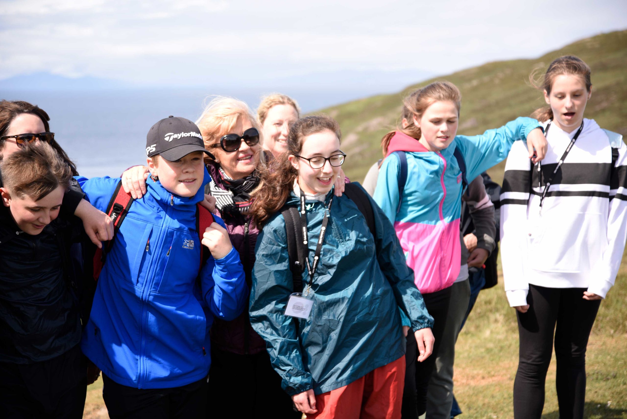 Group of teenagers outside in the sun on Skye