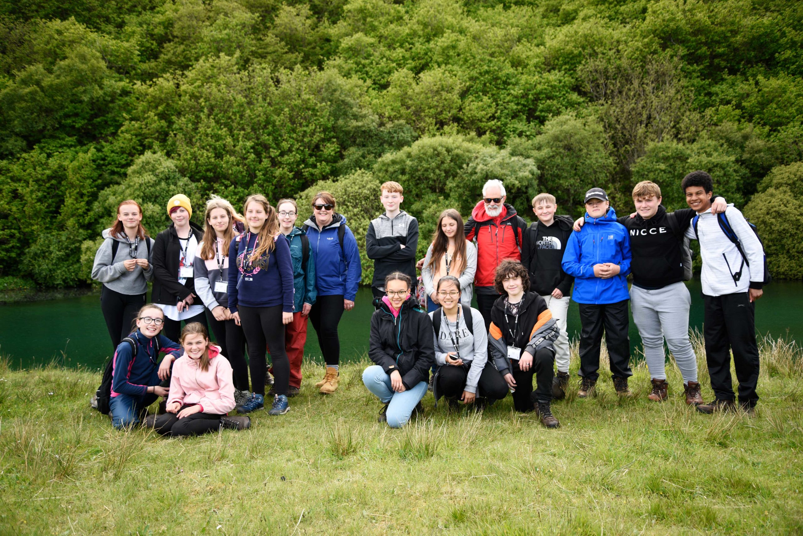 Large group on teenagers and instructor posing for a photo outside on Skye